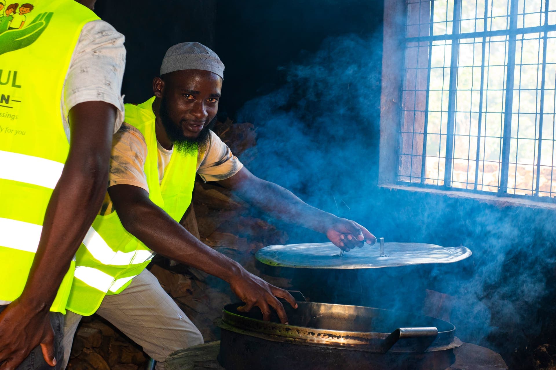 Tawakul Foundation volunteers preparing a meal for the children